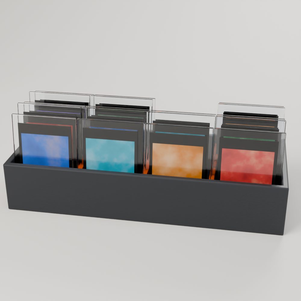 Charcoal storage tray with orange dividers holding rows of cards in toploaders